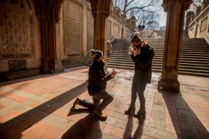 Guy kneels down to propose to his long term girlfriend 